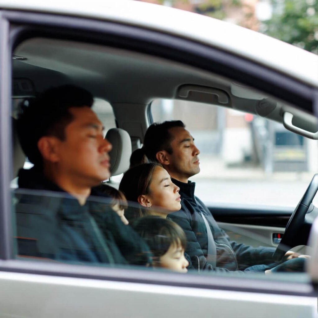 Family deep-breathing in traffic.
