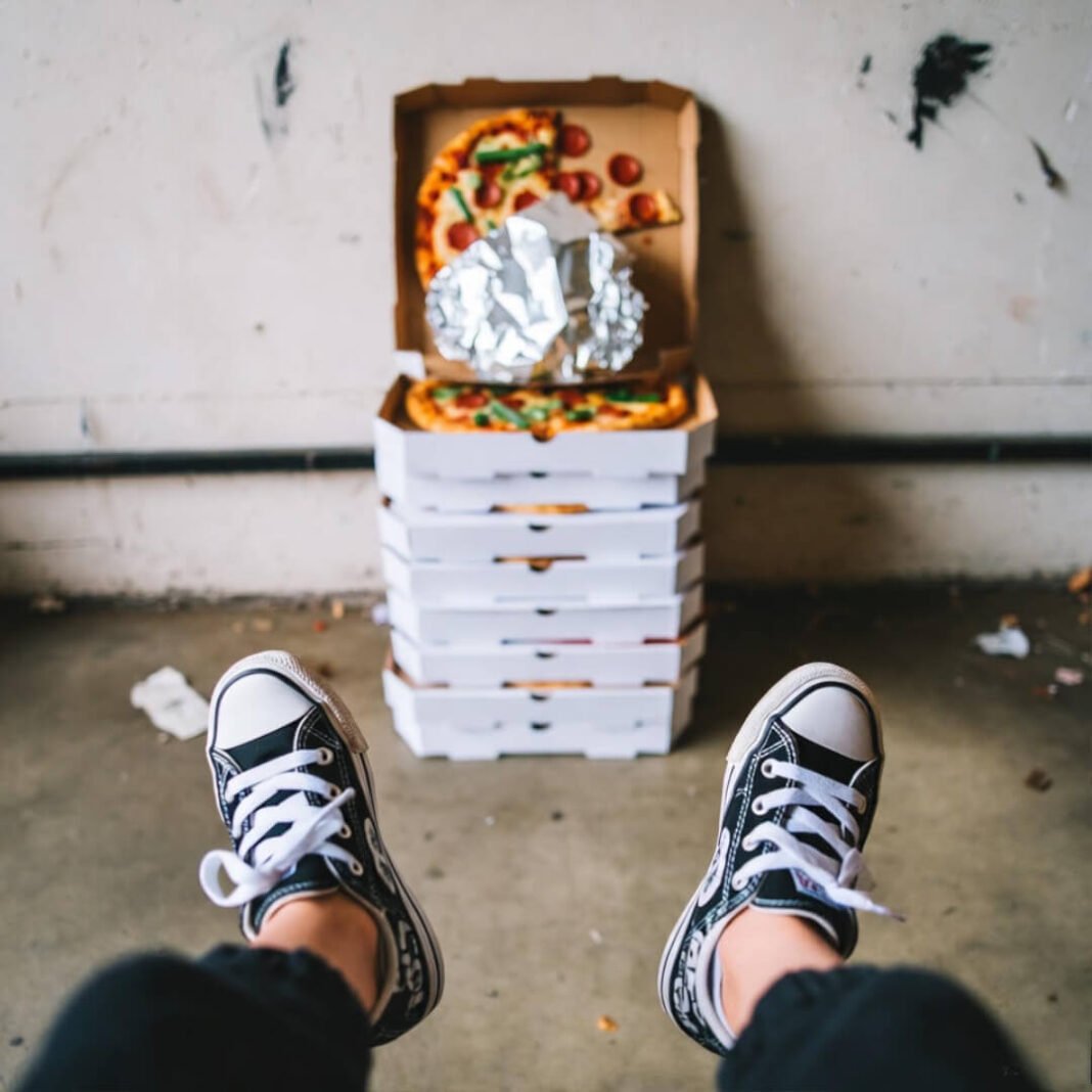 Sneakers leap pizza-box ladder.