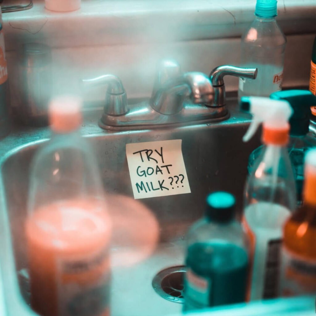 Overflowed sink, sticky note: “TRY GOAT MILK???”