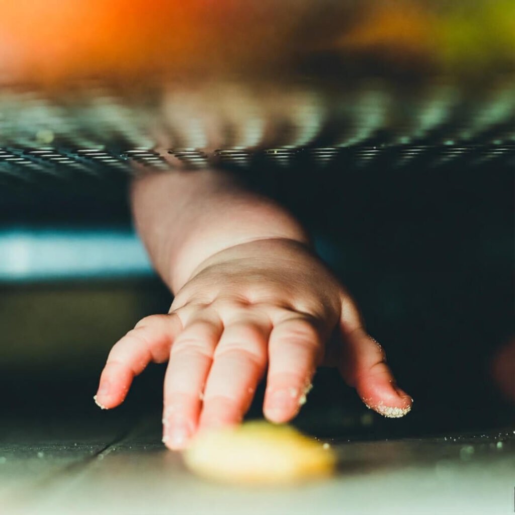 Flour hand grabs mango under fridge.